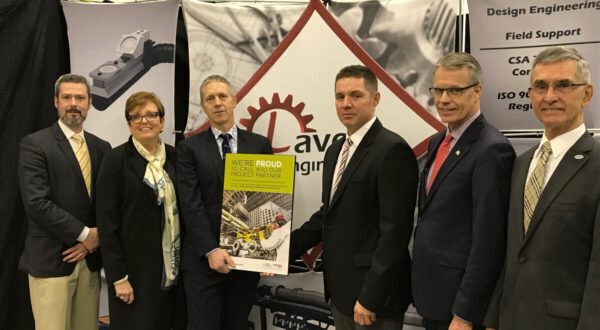 Peter Gowthorpe, Director of Laveer Engineering, receives a plaque from Ted Gruetzner, VP Stakeholder Relations with OPG.