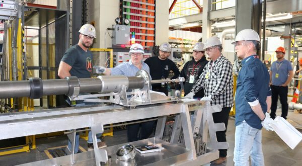 Lorraine Chipman, centre, instructs other millwrights at the full-scale reactor mock-up.