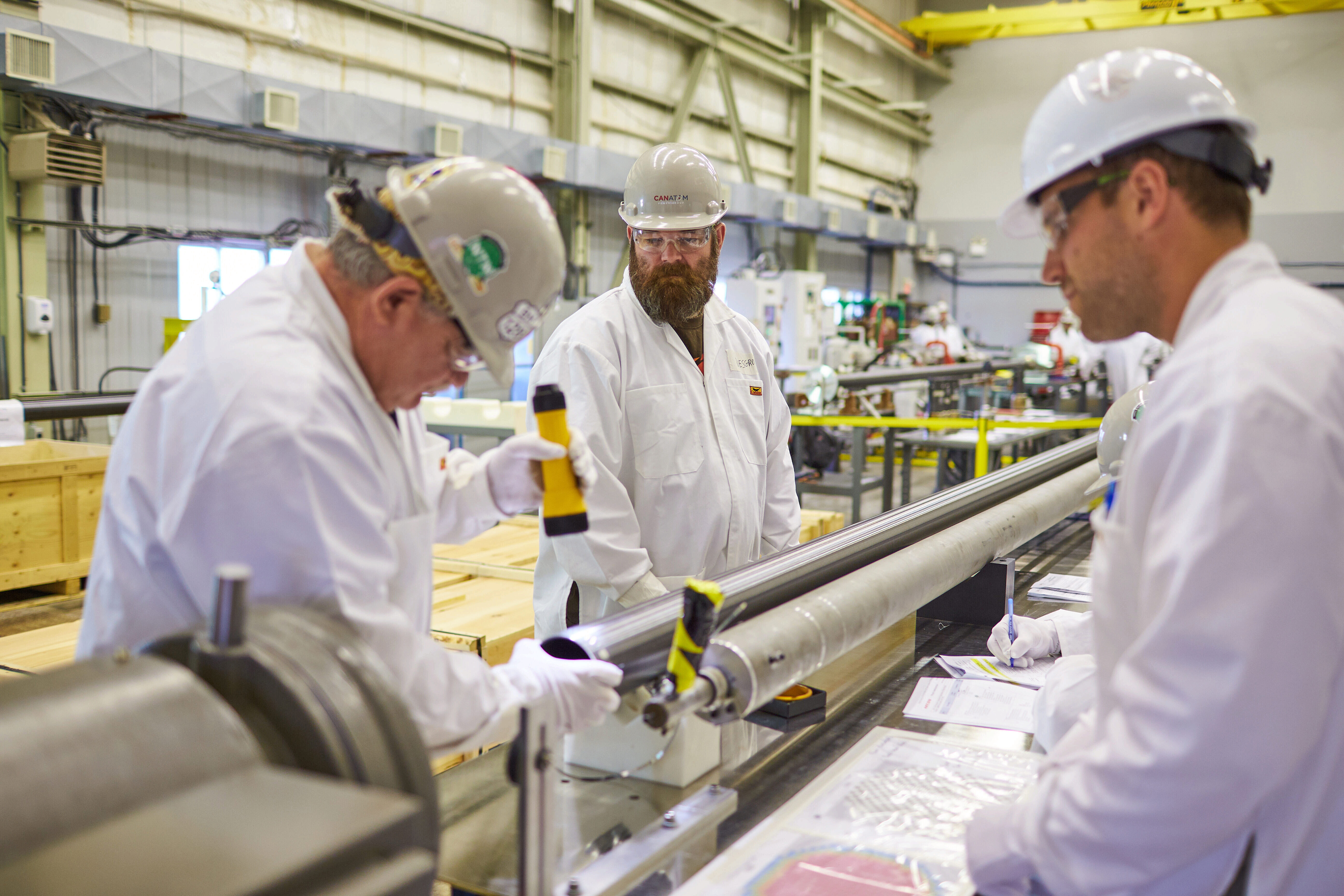 Workers assemble fuel channels for Darlington's Unit 2.