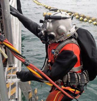 An OPG dive team member exits the water.