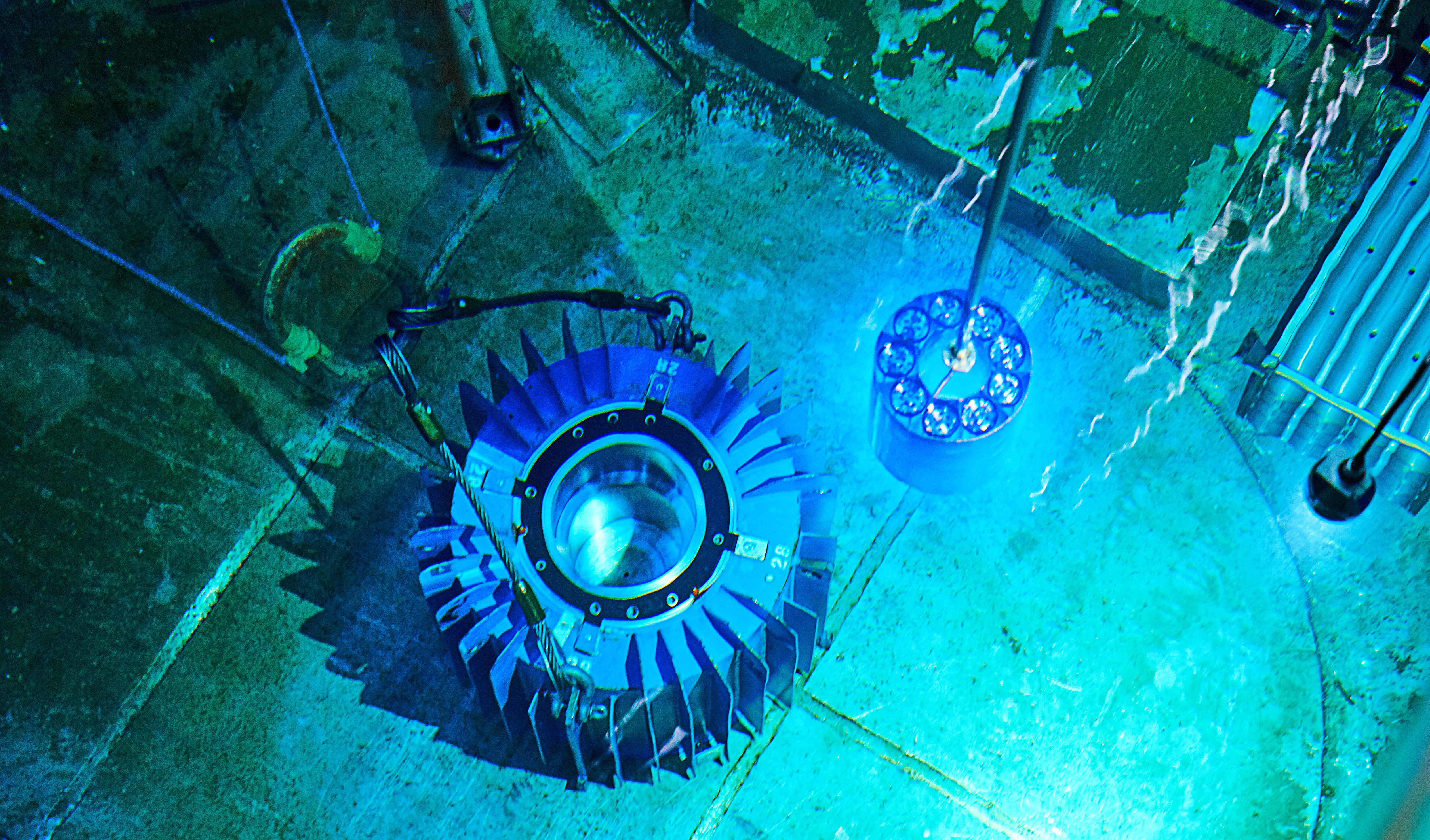 The isotope Cobalt-60 being extracted from a cooling pool.