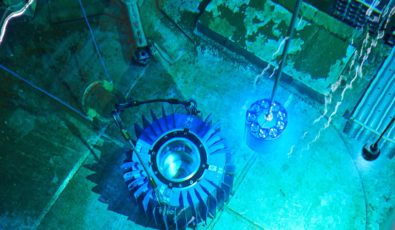 Cobalt-60 isotopes are placed into a flask in the spent fuel bay at Pickering Nuclear GS.