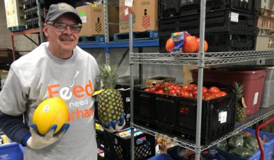 A worker with Feed the Need Durham setting up food deliveries.