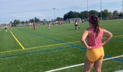 Outside of work, Vogl finds joy in building community and working with a team to achieve common goals by volunteering as a field hockey coach.