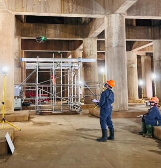 OPG employees control a drone to inspect Pickering Nuclear's vacuum building.