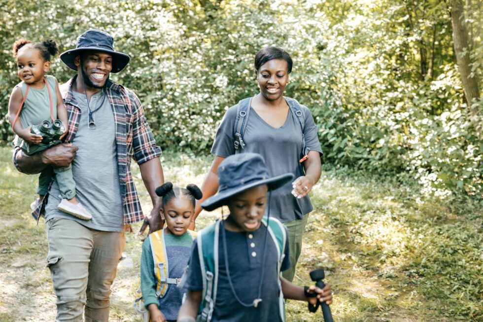 Parents and kids hiking together
