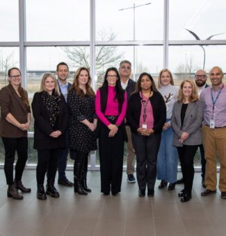Representatives from OPG, Aecon, Feed the Need in Durham, Ontario Shores, and Big Brothers Big Sisters of Clarington gather at OPG's Darlington Energy Complex.