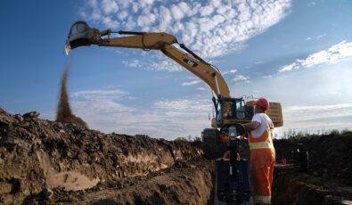 Workers and construction equipment engage in early site preparation work for OPG's Darlington New Nuclear Project.
