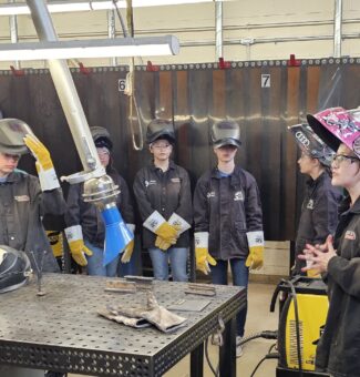 Students listen to instruction at the Mind Over Metal camp.