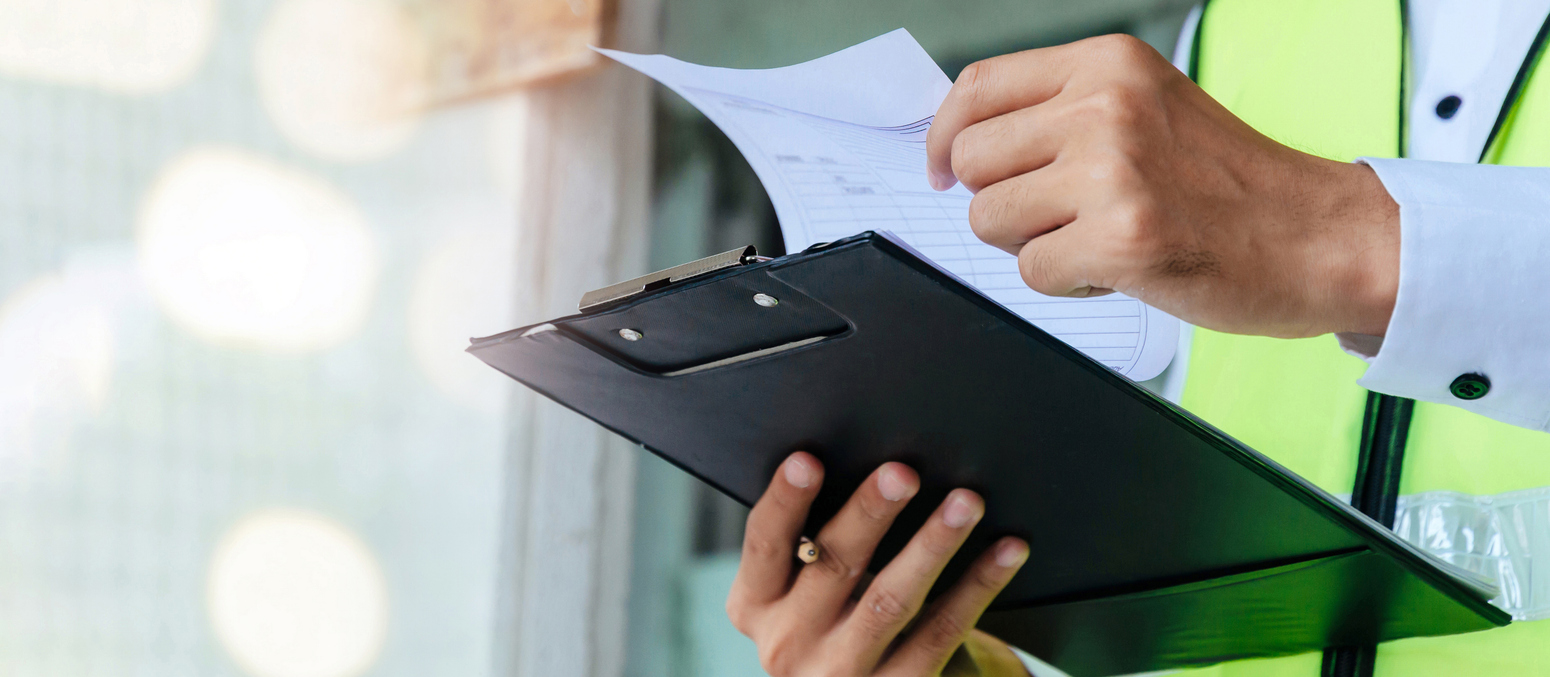 Employee looking at clipboard